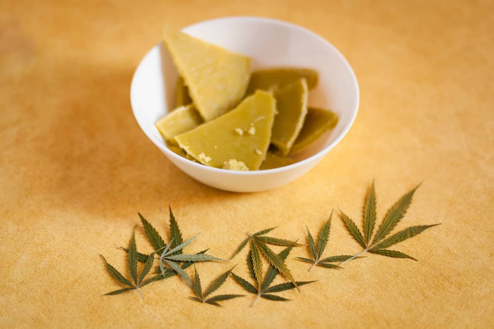 weed-butter-ready-to-use solid weed butter in a bowl with cannabis leaf